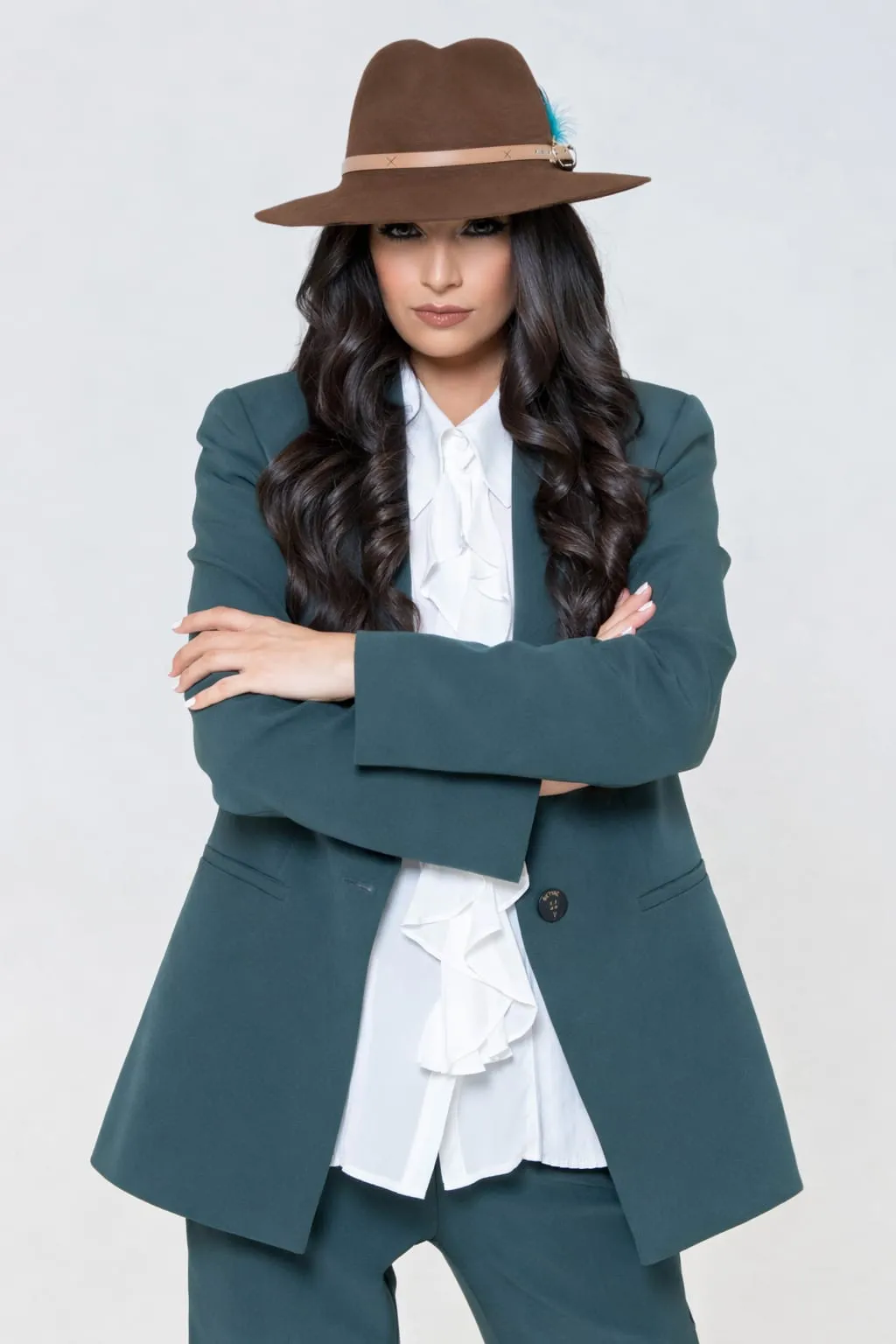 Portrait of Ghazaleh Ghasemi with arms crossed, Persian-Canadian bilingual master of ceremonies and motivational speaker in Toronto