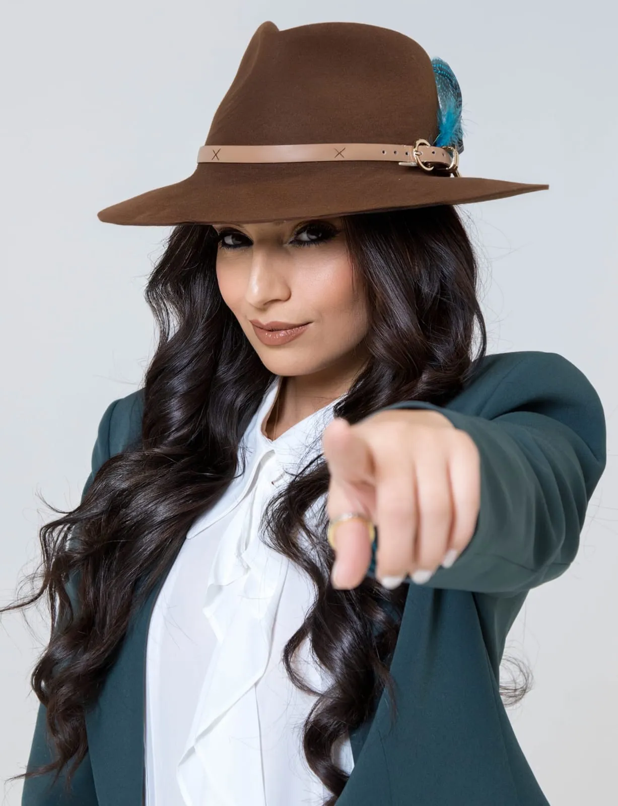 Portrait of Ghazaleh Ghasemi pointing, Persian-Canadian bilingual master of ceremonies and motivational speaker in Toronto
